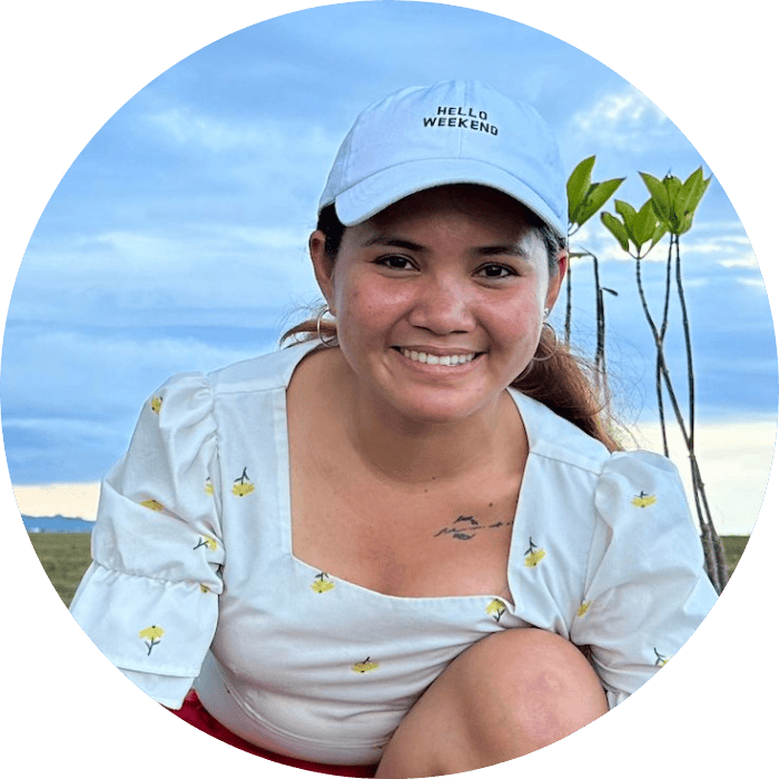 Climate activist Marinel planting mangrove seeds