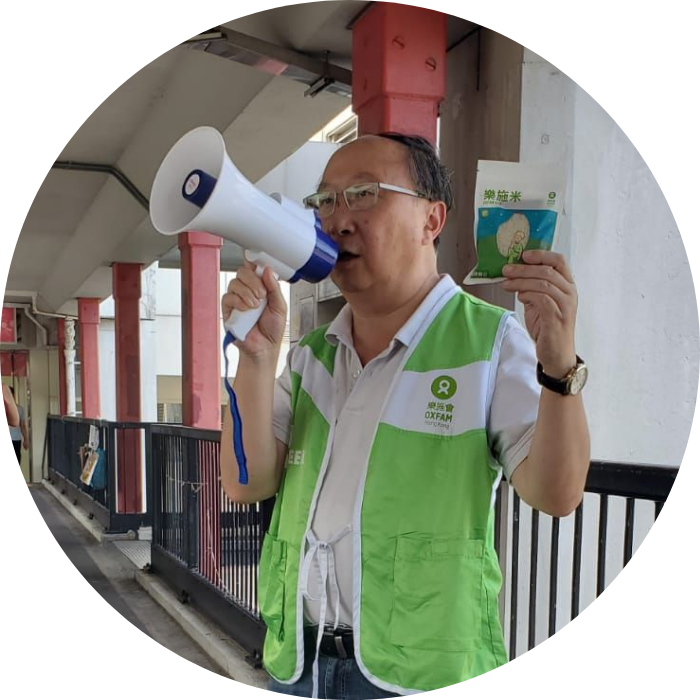 Oxfam supporter speaking through a megaphone (Hong Kong)